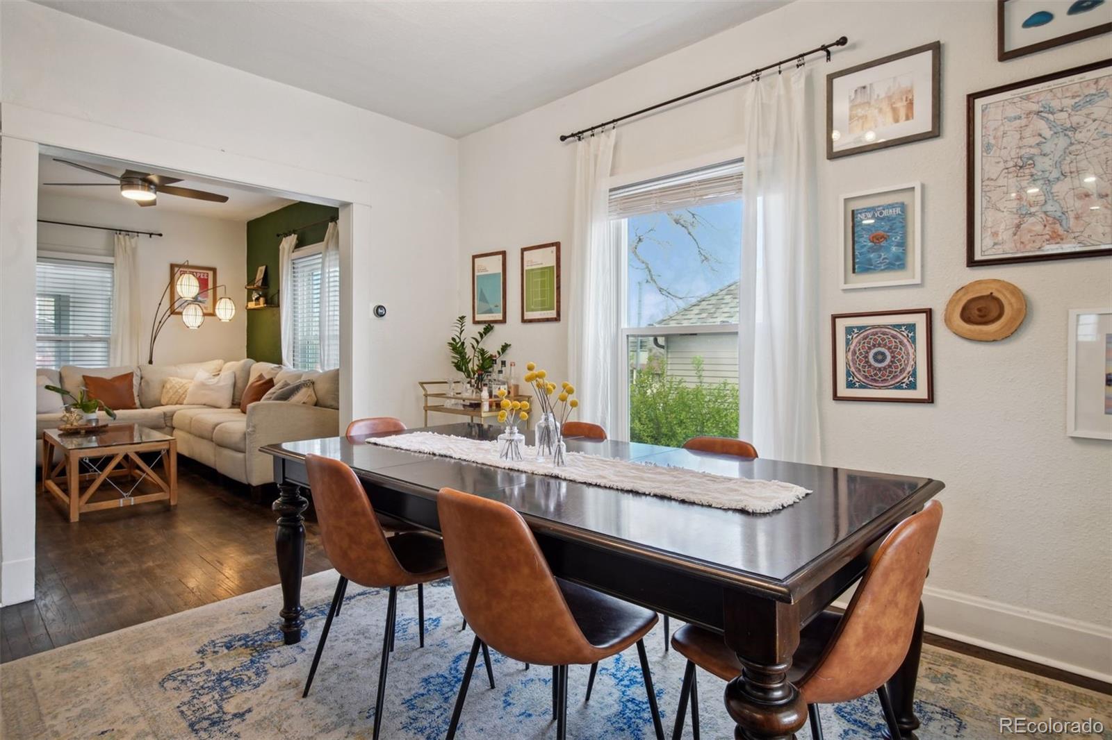 60 Perry Street Denver, CO 80219 - Photo 14 of 43 a view of a dining room with furniture window and wooden floor