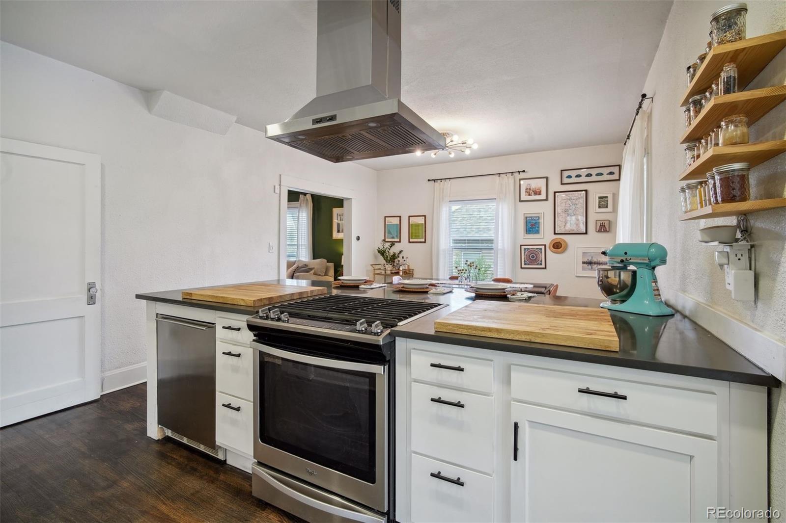 60 Perry Street Denver, CO 80219 - Photo 18 of 43 a kitchen with stainless steel appliances granite countertop a stove and a sink
