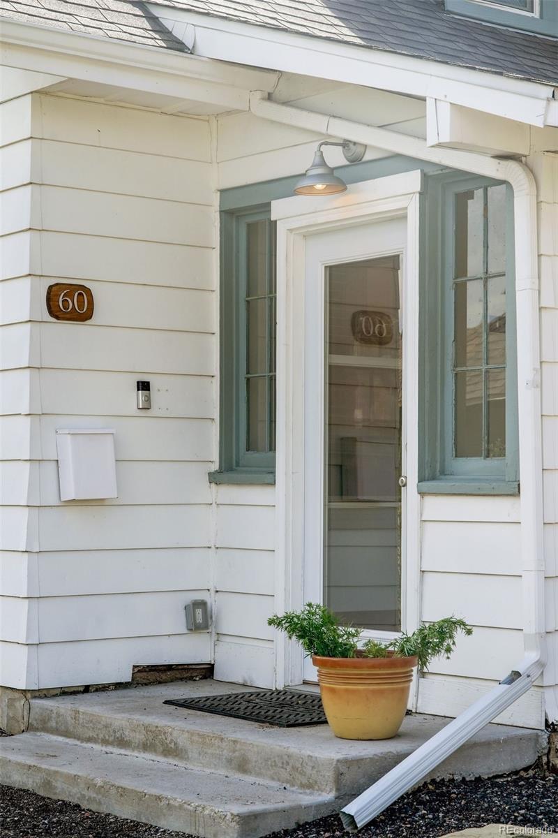 60 Perry Street Denver, CO 80219 - Photo 2 of 43 a view of front door of house with potted plants