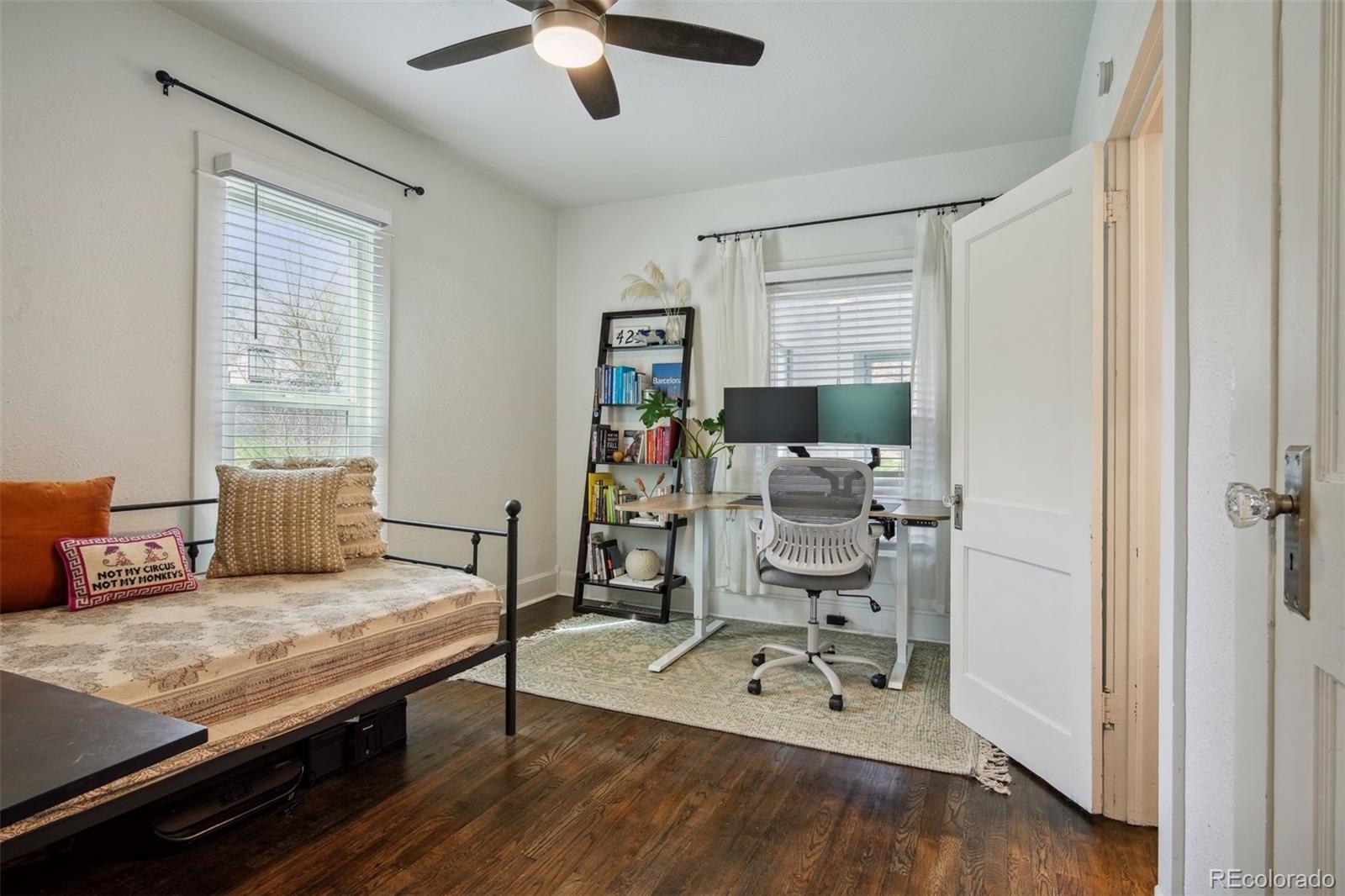 60 Perry Street Denver, CO 80219 - Photo 22 of 43 a living room with furniture and wooden floor