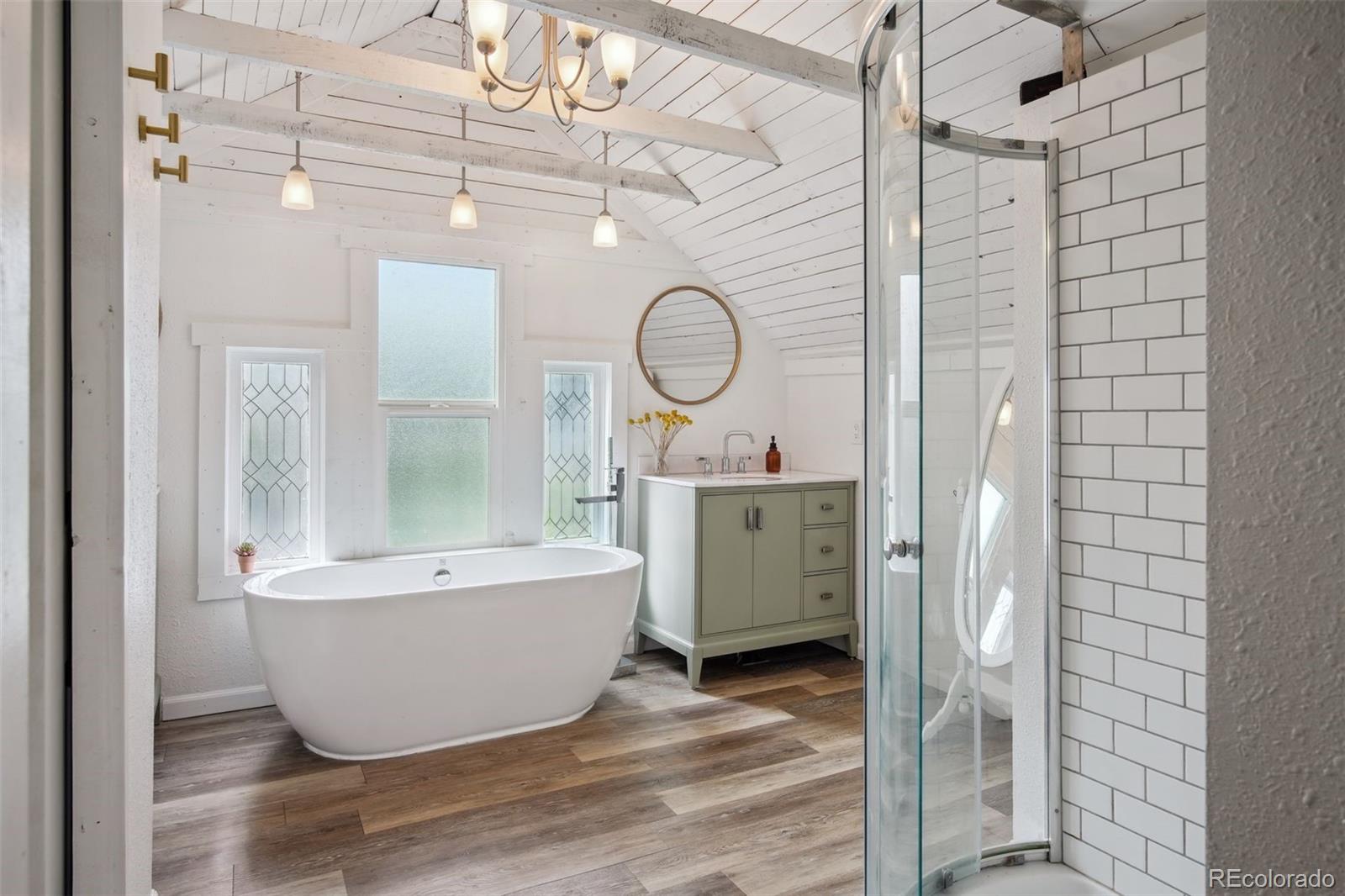 60 Perry Street Denver, CO 80219 - Photo 26 of 43 a bathroom with a bathtub and shower