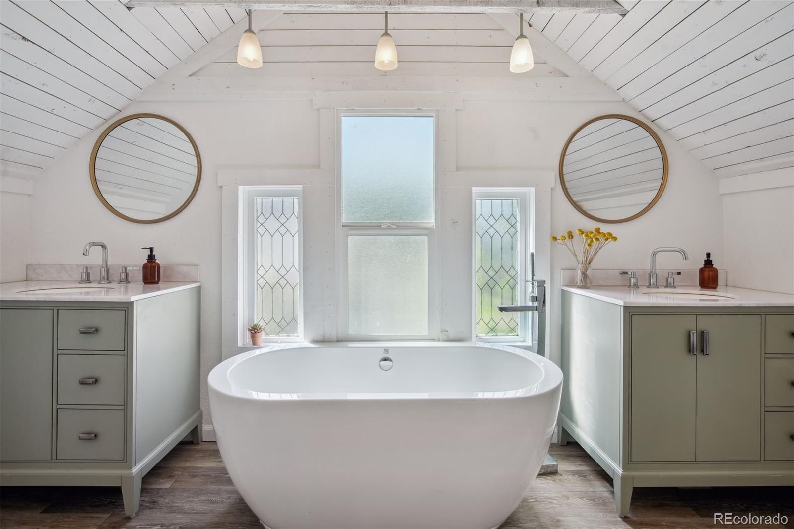 60 Perry Street Denver, CO 80219 - Photo 27 of 43 a living room with furniture and a mirror