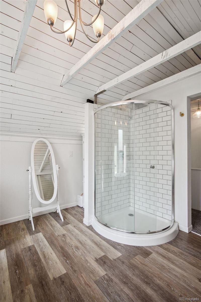 60 Perry Street Denver, CO 80219 - Photo 28 of 43 a room with wooden floor and a window