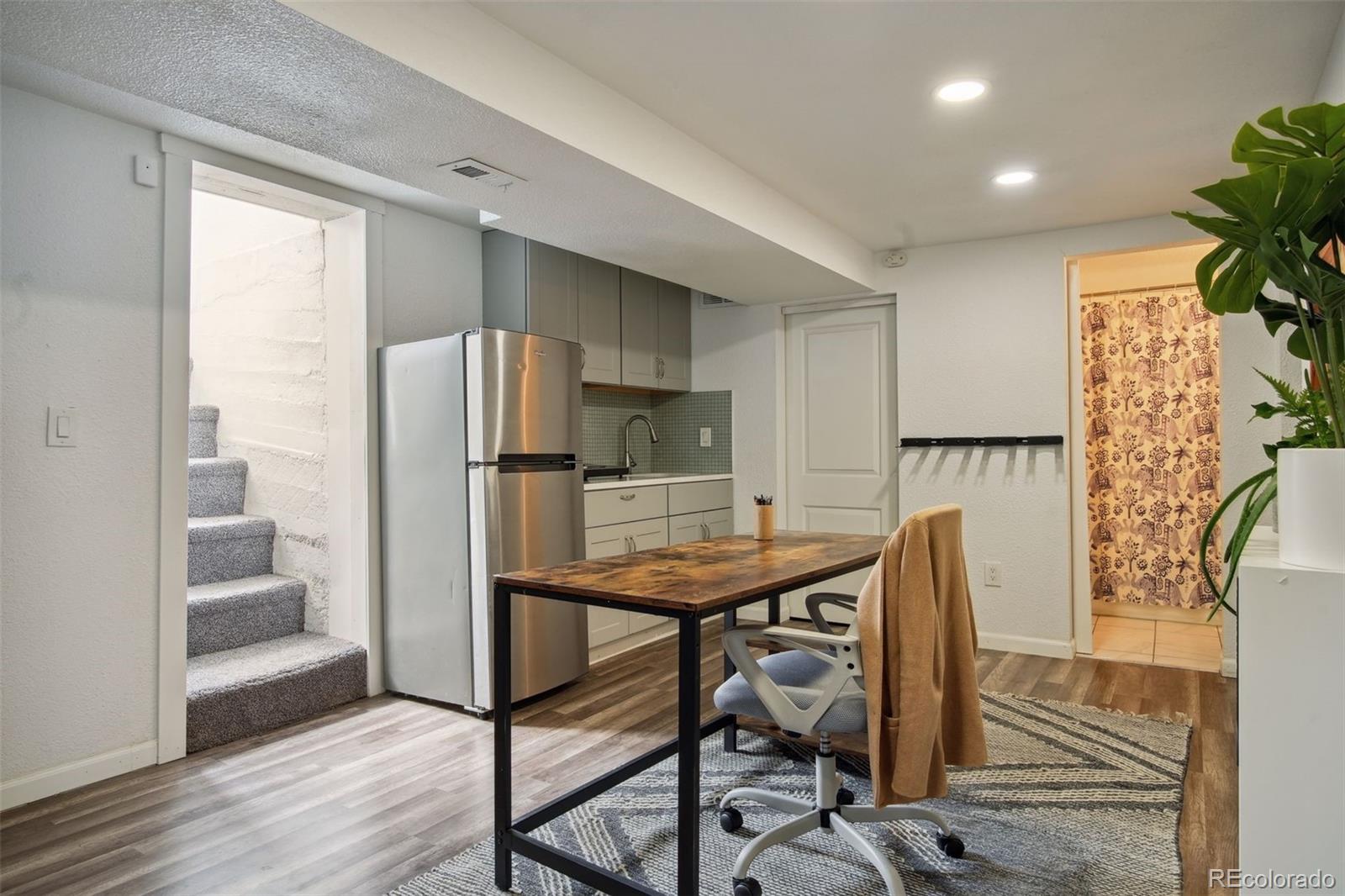 60 Perry Street Denver, CO 80219 - Photo 29 of 43 a view of a kitchen with furniture and wooden floor
