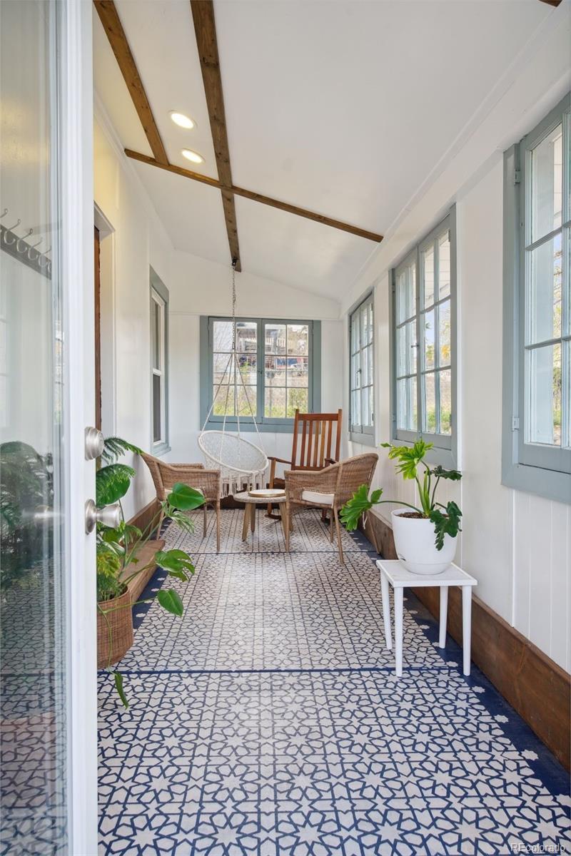60 Perry Street Denver, CO 80219 - Photo 3 of 43 a living room with furniture and a table
