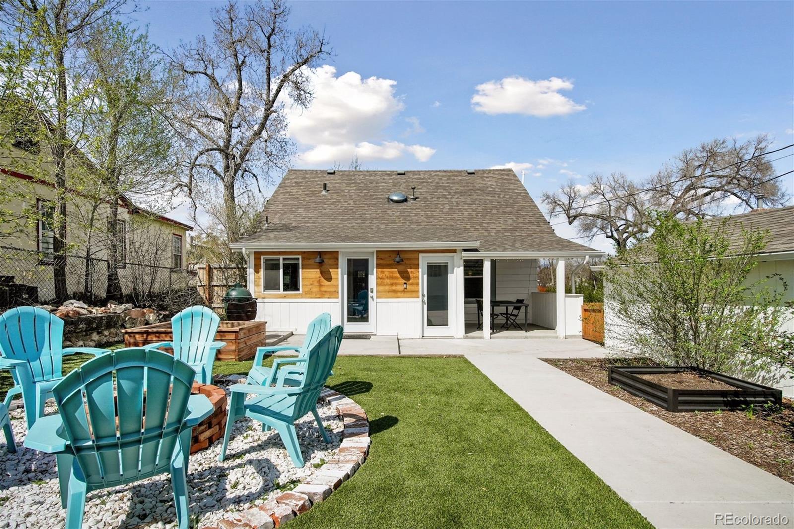 60 Perry Street Denver, CO 80219 - Photo 35 of 43 a front view of house with yard outdoor seating and barbeque oven