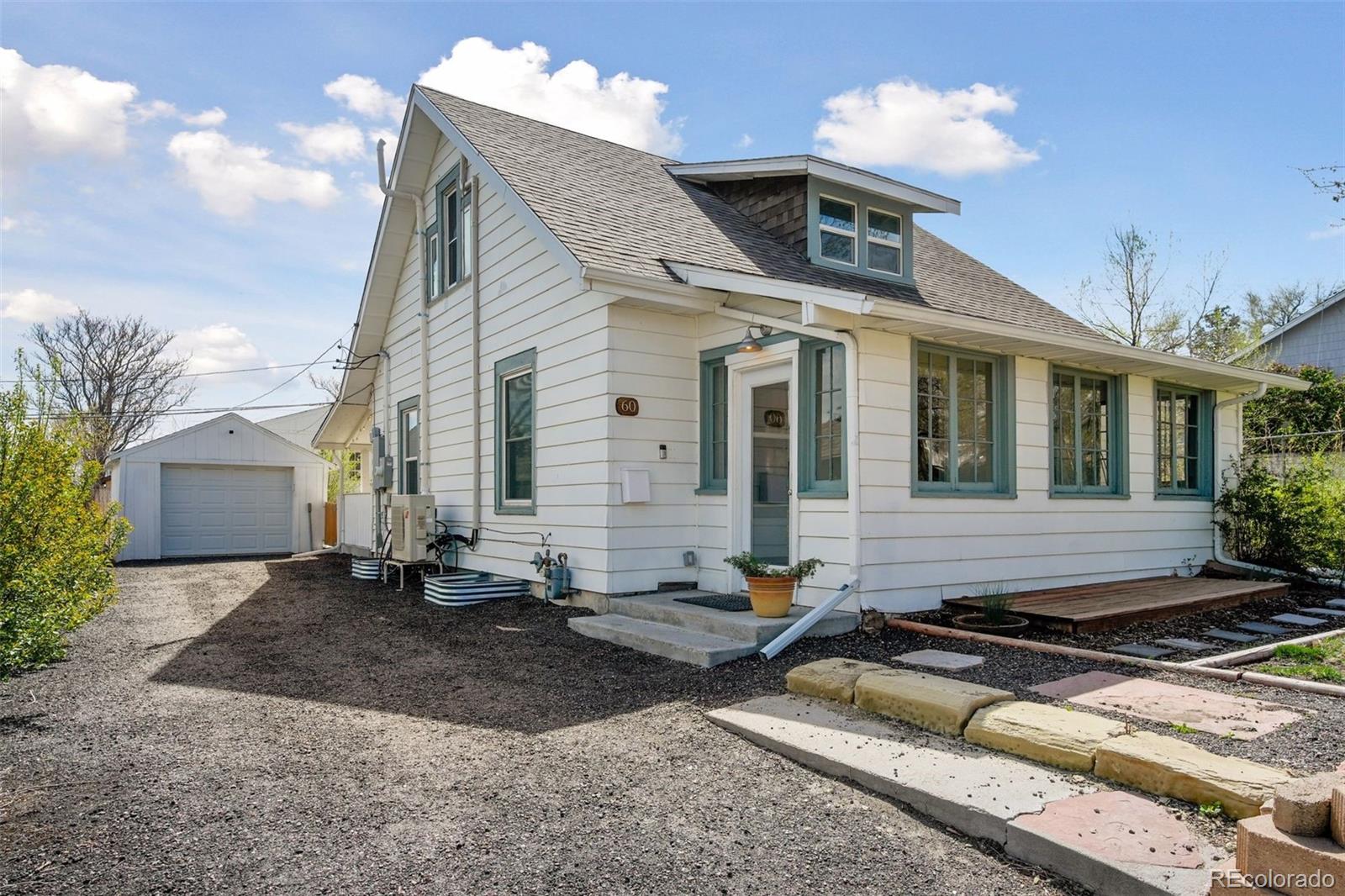60 Perry Street Denver, CO 80219 - Photo 40 of 43 a front view of a house with a yard