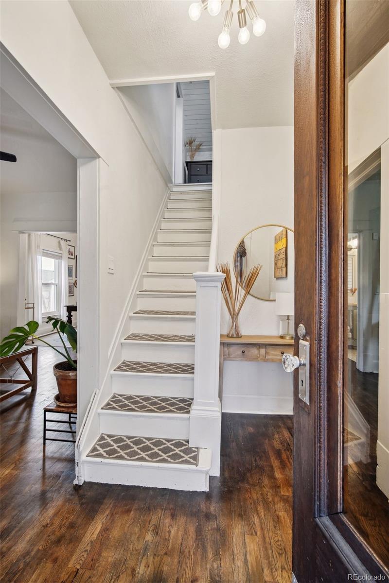 60 Perry Street Denver, CO 80219 - Photo 7 of 43 a view of entryway and hall with wooden floor