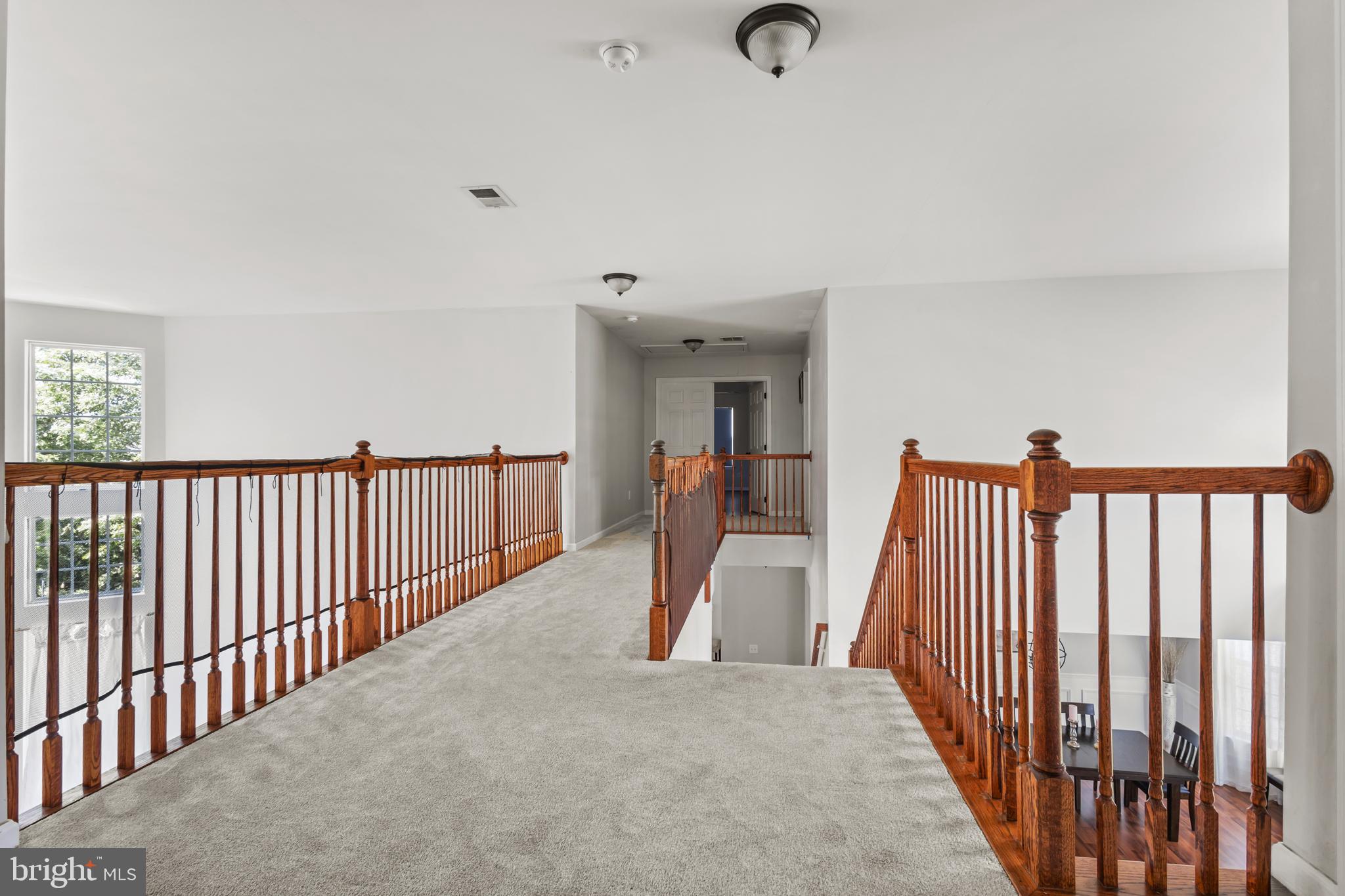 2603 Valhalla Road Vineland, NJ 08361 - Photo 23 of 43 a view of a hallway with wooden floor and stairs