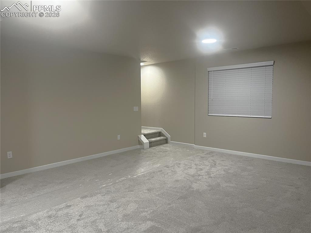6684 Rawhide Rdg View Colorado Springs, CO 80915 - Photo 26 of 37 an empty room with windows