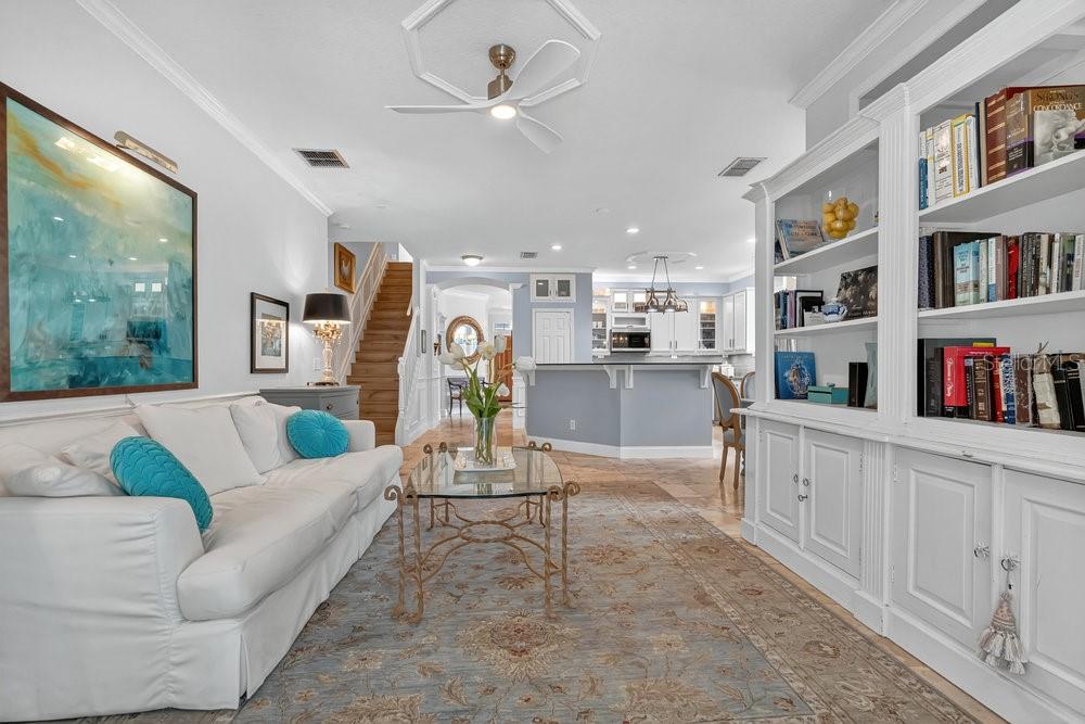 8375 Bowden Way Windermere, FL 34786 - Photo 16 of 62 a living room with furniture and a kitchen area