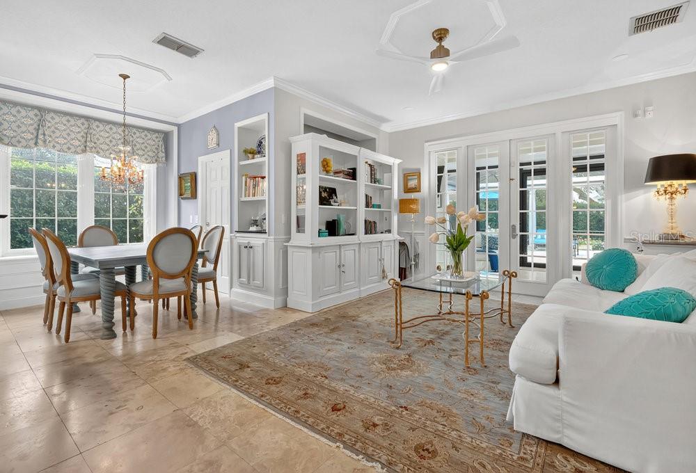 8375 Bowden Way Windermere, FL 34786 - Photo 17 of 62 a living room with furniture a dining table and a large window