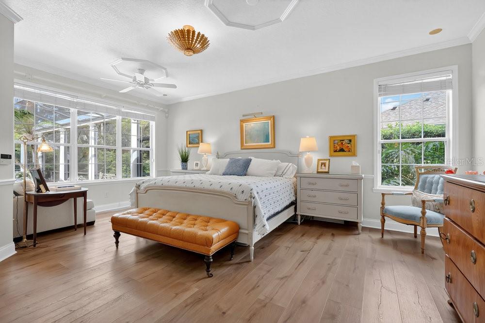 8375 Bowden Way Windermere, FL 34786 - Photo 20 of 62 a bedroom with a bed and wooden floor