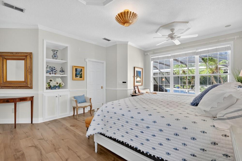 8375 Bowden Way Windermere, FL 34786 - Photo 21 of 62 a bedroom with a bed mirror and a window