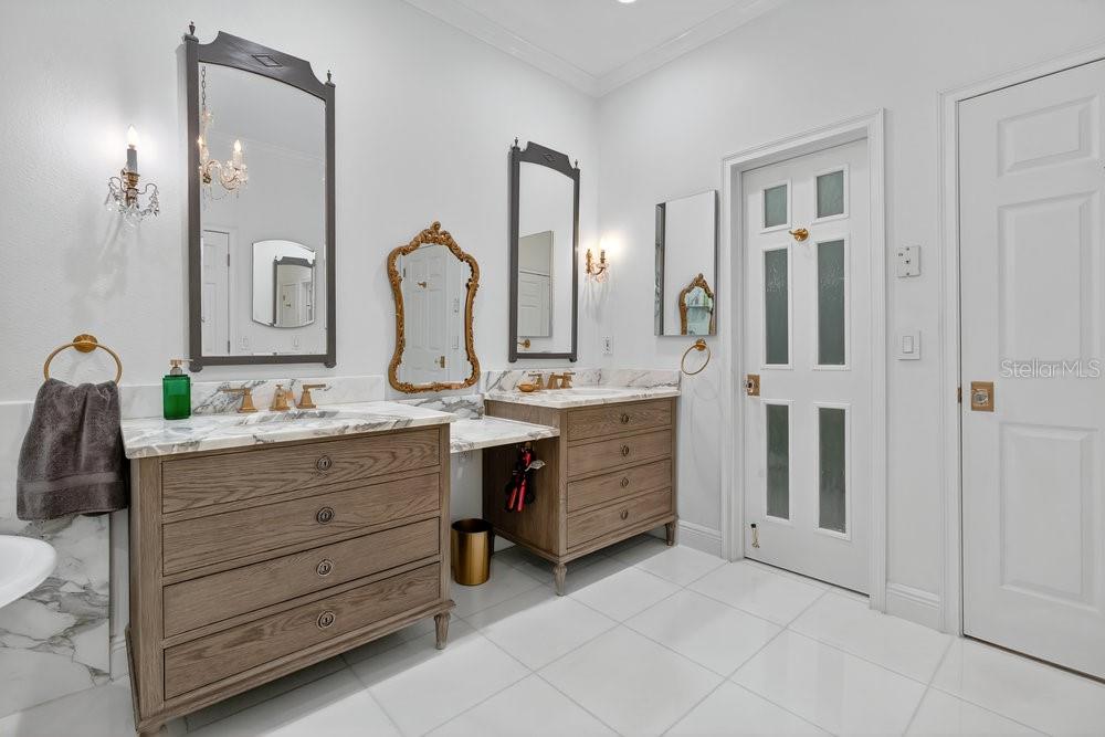 8375 Bowden Way Windermere, FL 34786 - Photo 24 of 62 a bathroom with a double vanity sink and a mirror
