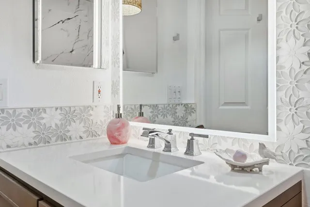 a living room with furniture and a book shelf