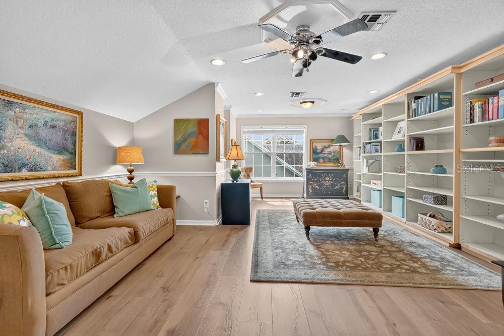 8375 Bowden Way Windermere, FL 34786 - Photo 33 of 62 a living room with furniture and a book shelf