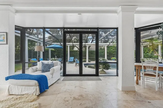 a view of a swimming pool with a lounge chair