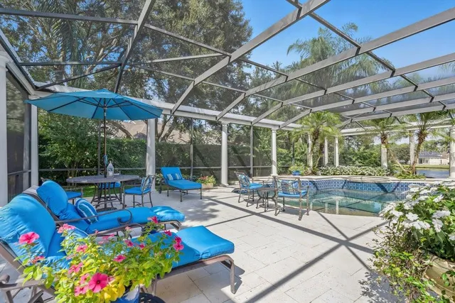 an aerial view of a pool patio yard and outdoor seating