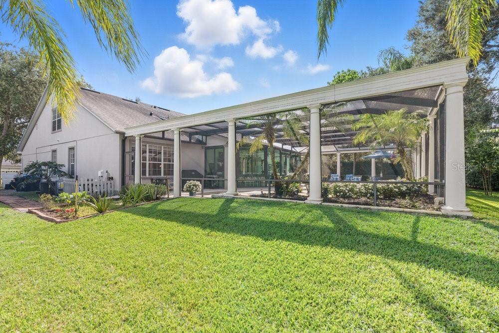 8375 Bowden Way Windermere, FL 34786 - Photo 52 of 62 a view of a house with backyard sitting area and garden