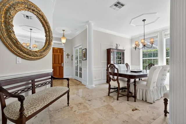 a kitchen with stainless steel appliances granite countertop a sink a stove and cabinets
