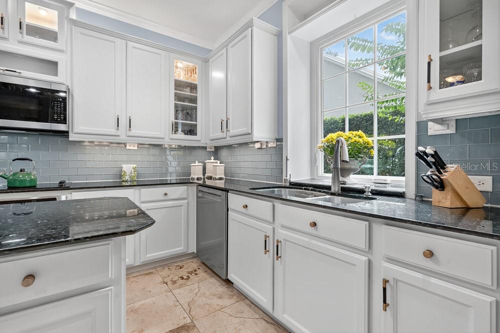 8375 Bowden Way Windermere, FL 34786 - Photo 9 of 62 a kitchen with stainless steel appliances granite countertop a sink a stove and cabinets