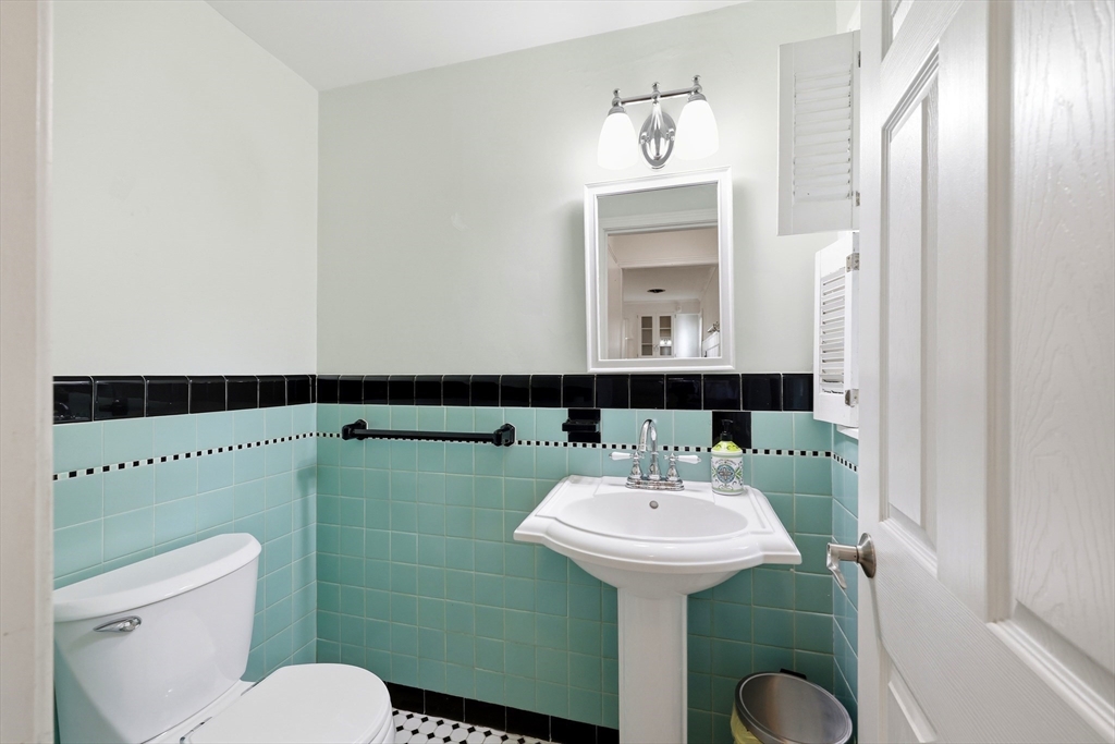 130 Connecticut Avenue Springfield, MA 01107 - Photo 16 of 40 a bathroom with a sink toilet and mirror