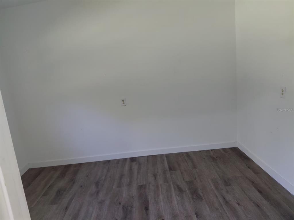 17405 Northeast 38th Lane Road Silver Springs, FL 34488 - Photo 13 of 25 a view of an empty room