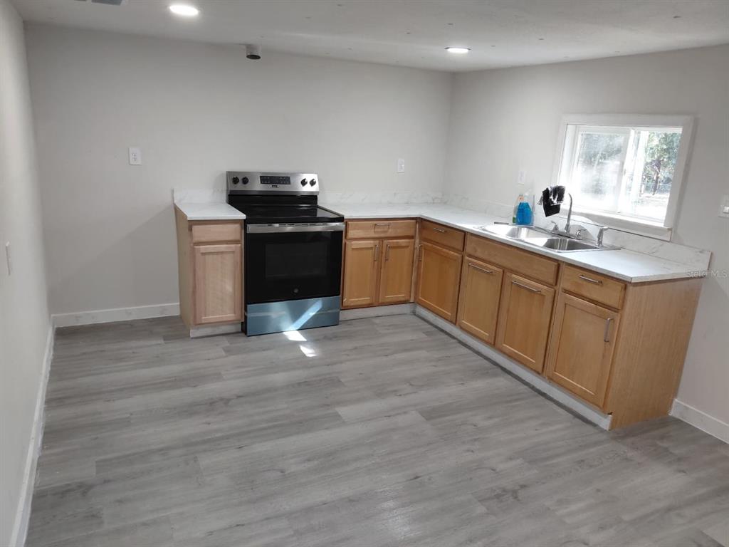 17405 Northeast 38th Lane Road Silver Springs, FL 34488 - Photo 15 of 25 a kitchen with a sink and cabinets