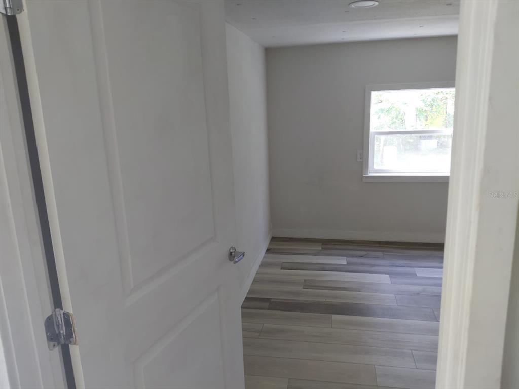 17405 Northeast 38th Lane Road Silver Springs, FL 34488 - Photo 19 of 25 a view of an empty room with a window