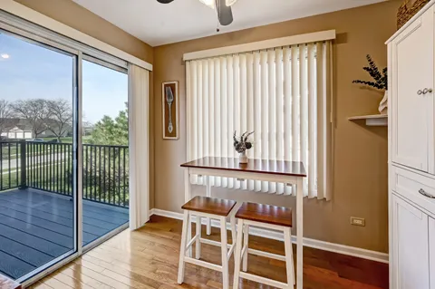 a view of a balcony with wooden floor