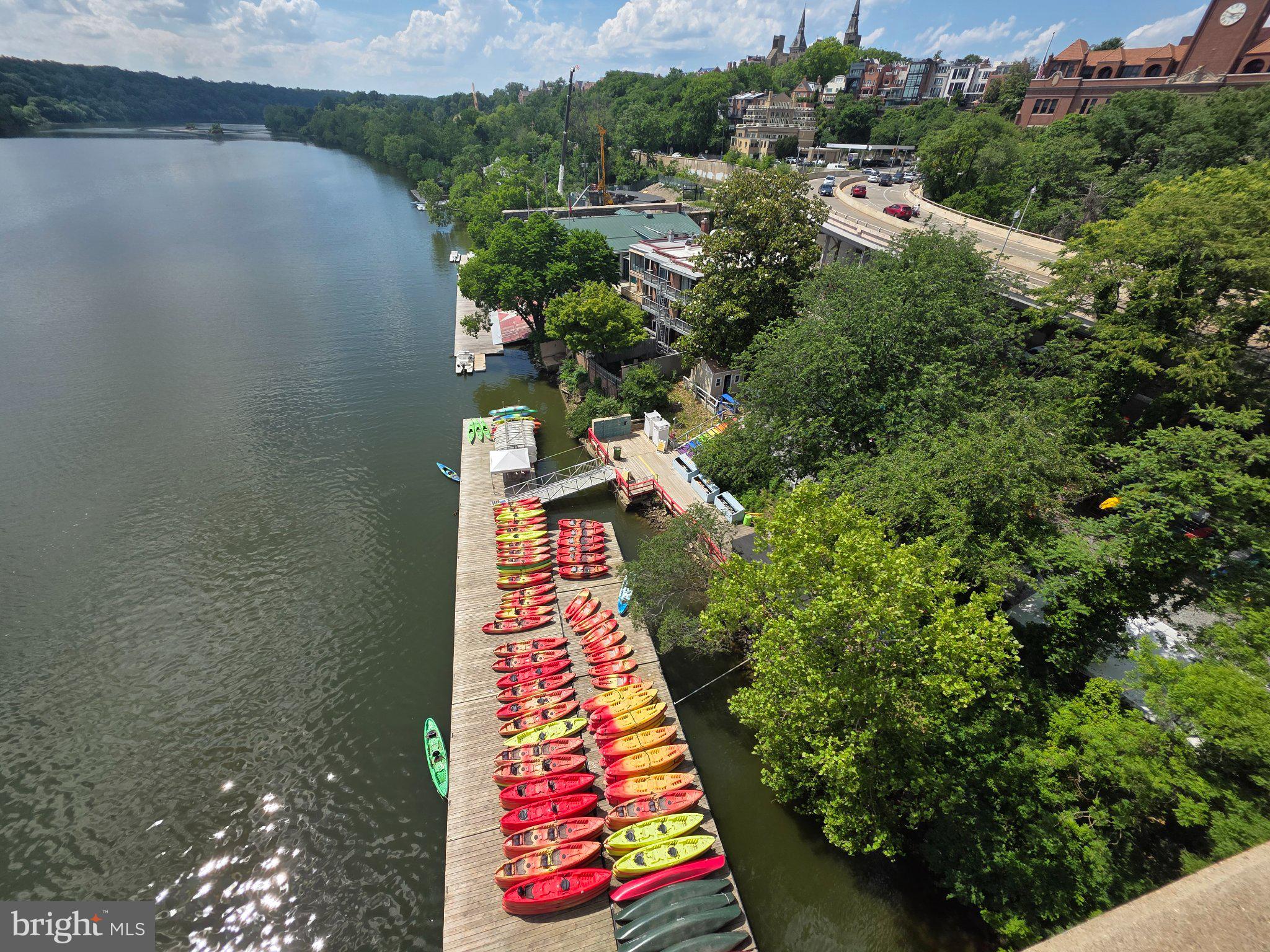 3643 St Mary's Place Northwest Washington, DC 20007 - Photo 44 of 49 Colorful kayaks lined by the riverbank.