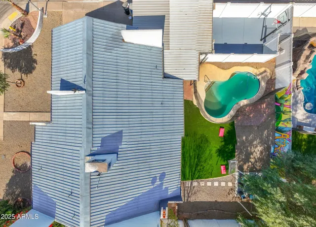 a view of a swimming pool with a potted plants