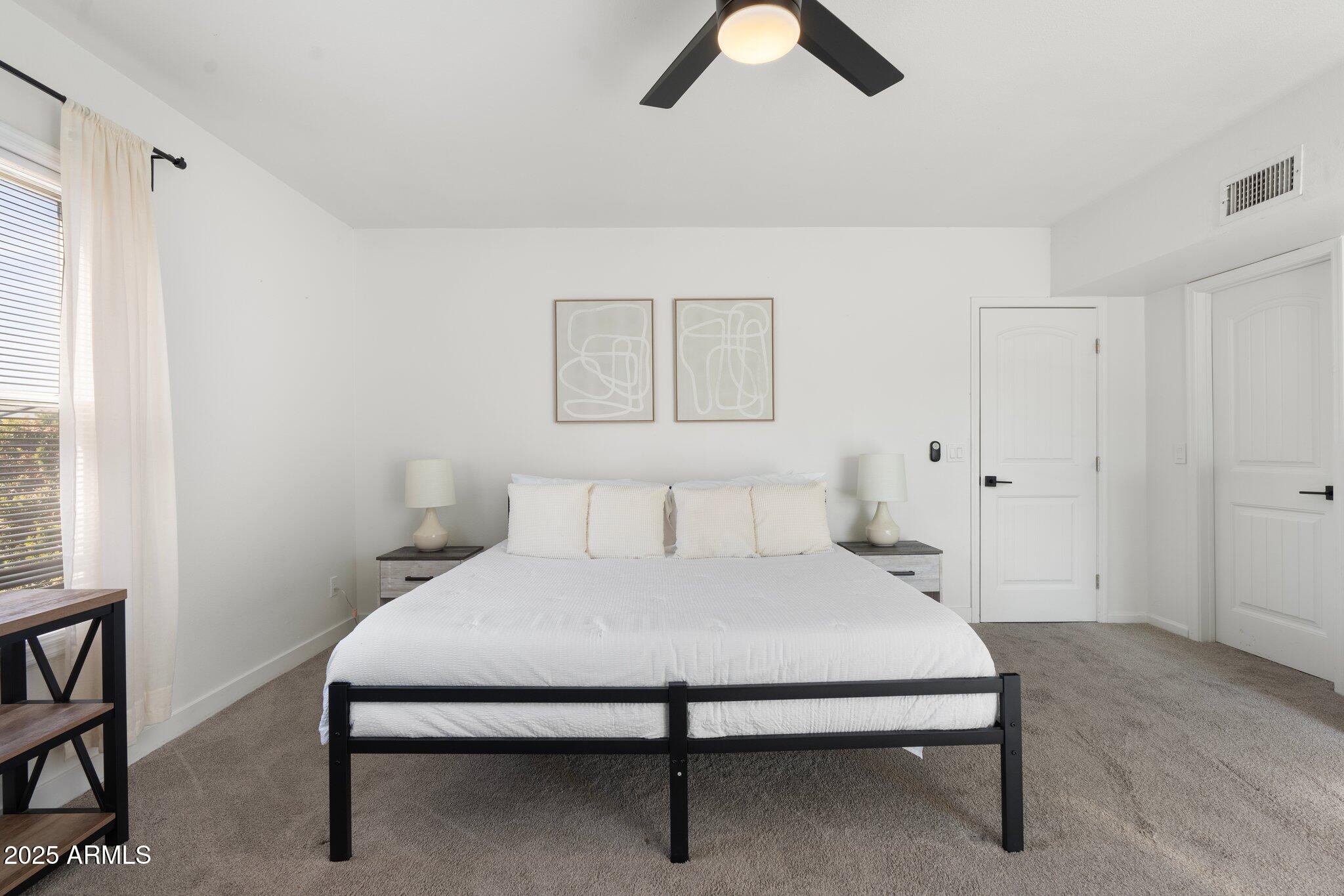 1759 North Spring Circle Mesa, AZ 85203 - Photo 39 of 69 a bedroom with a bed and cabinet