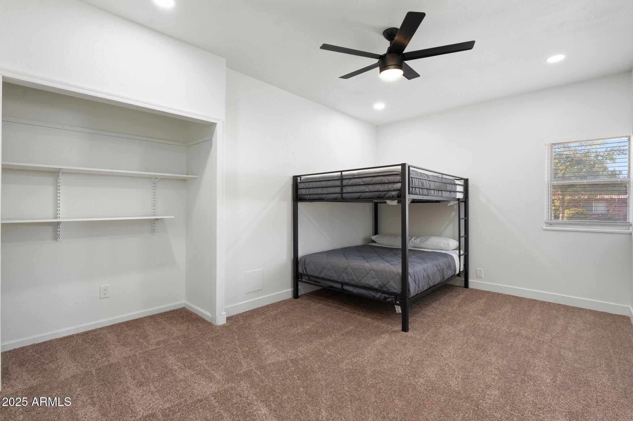 1759 North Spring Circle Mesa, AZ 85203 - Photo 49 of 69 a living room with a ceiling fan