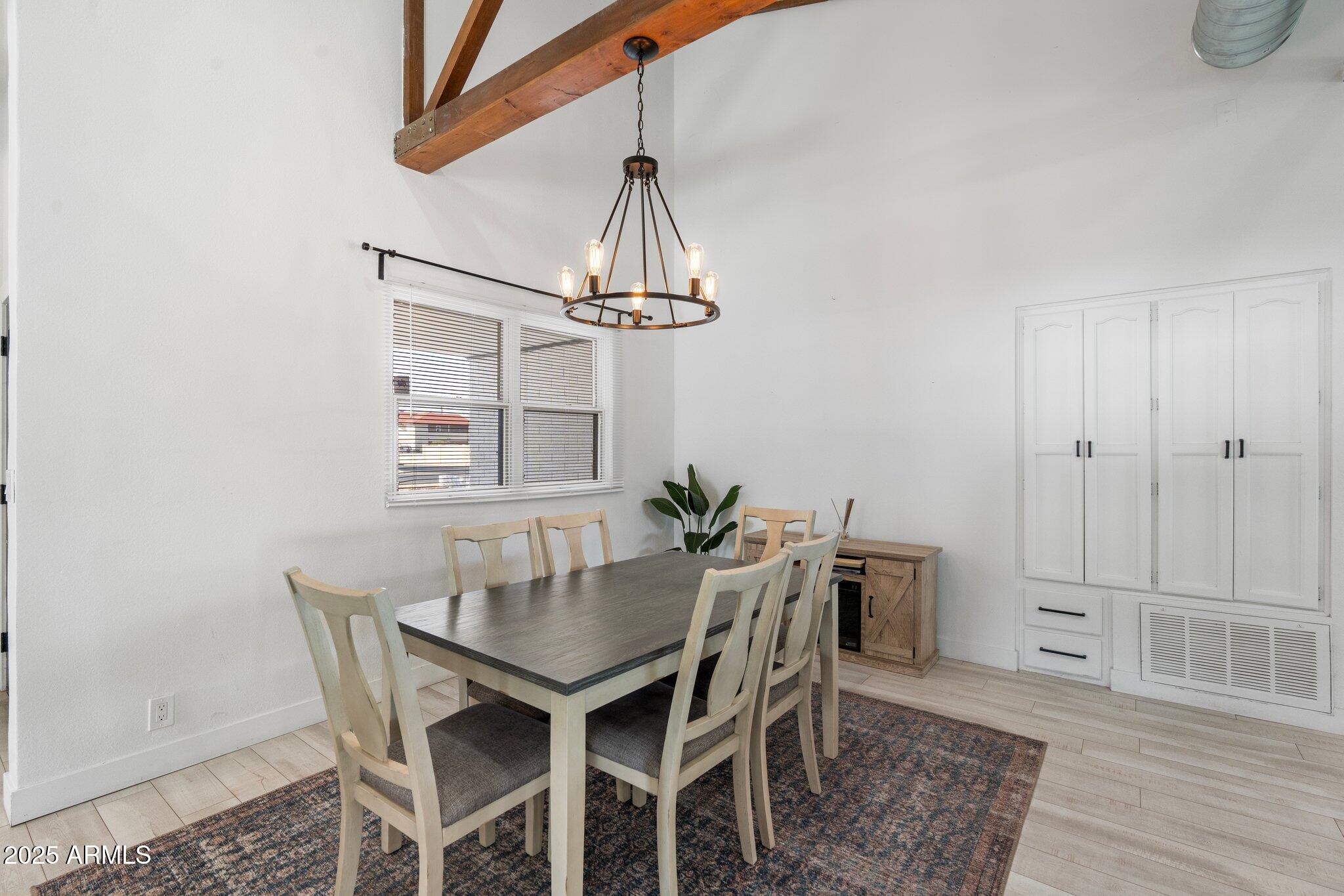 1759 North Spring Circle Mesa, AZ 85203 - Photo 52 of 69 a view of a dining room with a table and chairs