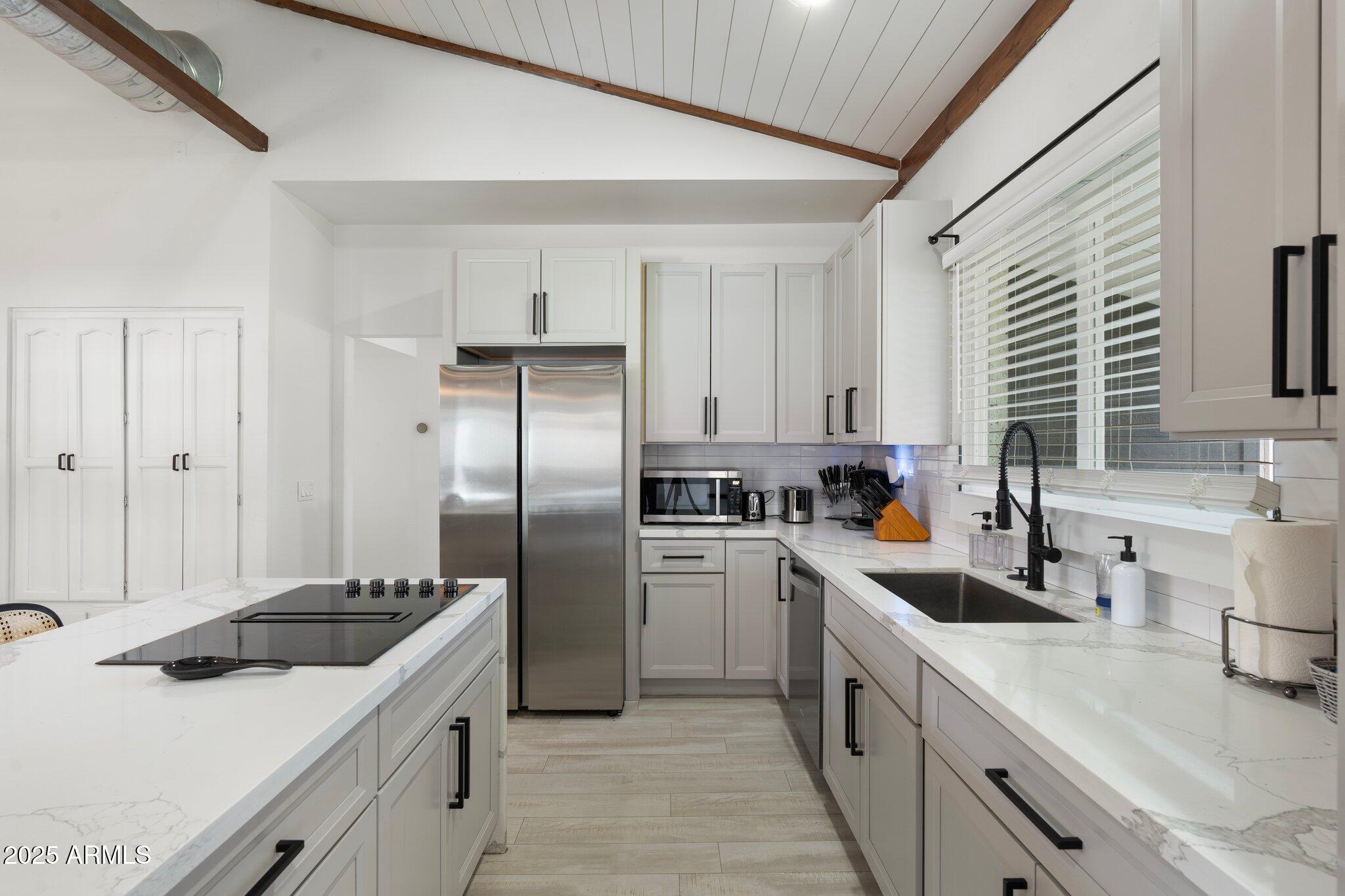 1759 North Spring Circle Mesa, AZ 85203 - Photo 65 of 69 a kitchen with a sink stove and refrigerator