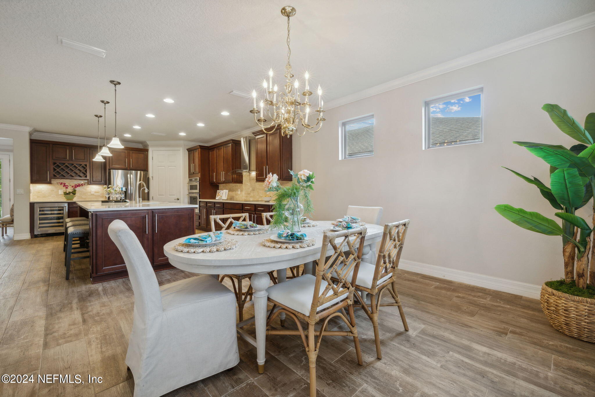376 Eagle Pass Drive Ponte Vedra, FL 32081 - Photo 11 of 52 a dining room with furniture potted plants and wooden floor