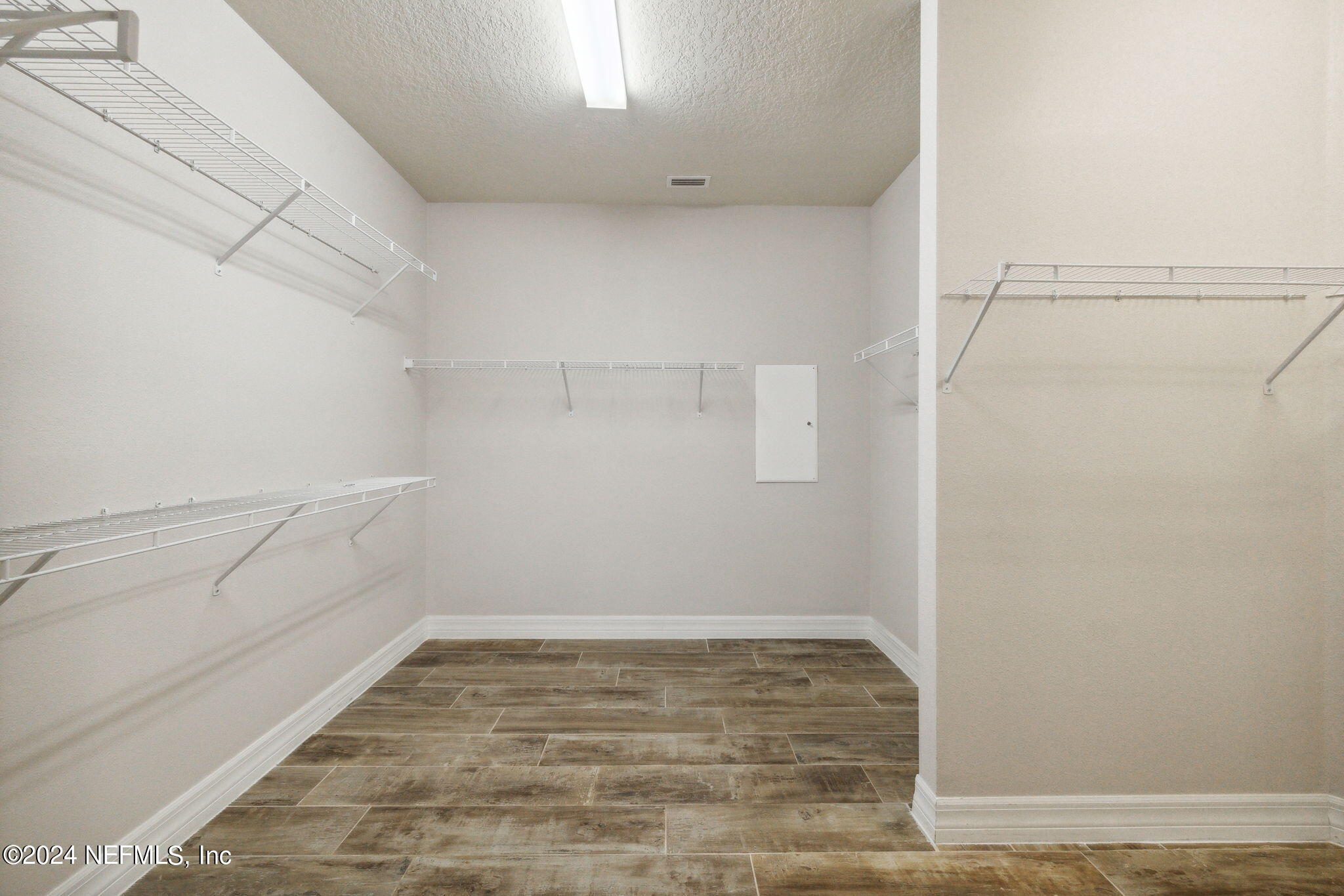 376 Eagle Pass Drive Ponte Vedra, FL 32081 - Photo 19 of 52 a view of a room with empty racks