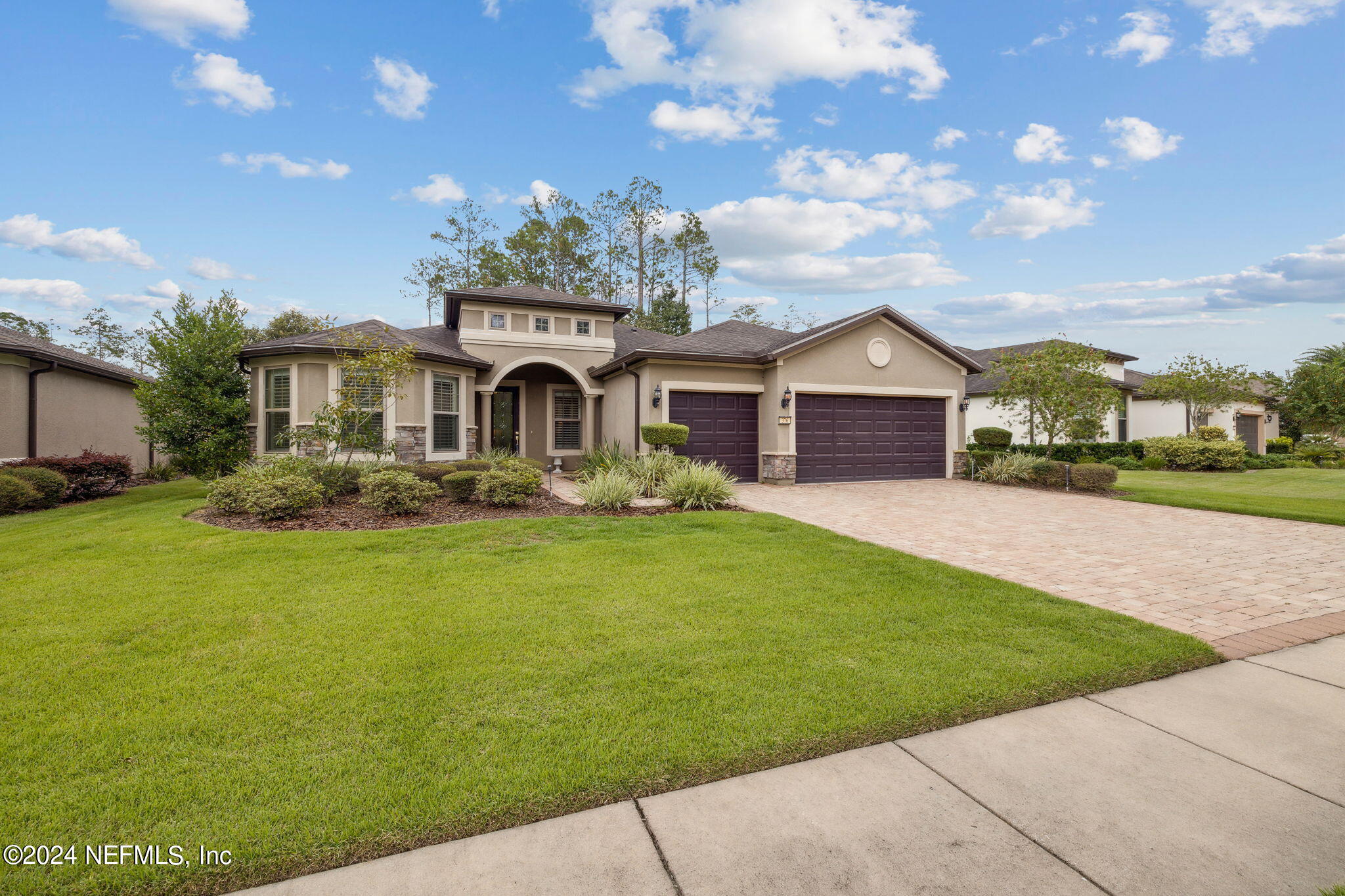 376 Eagle Pass Drive Ponte Vedra, FL 32081 - Photo 2 of 52 a front view of a house with garden