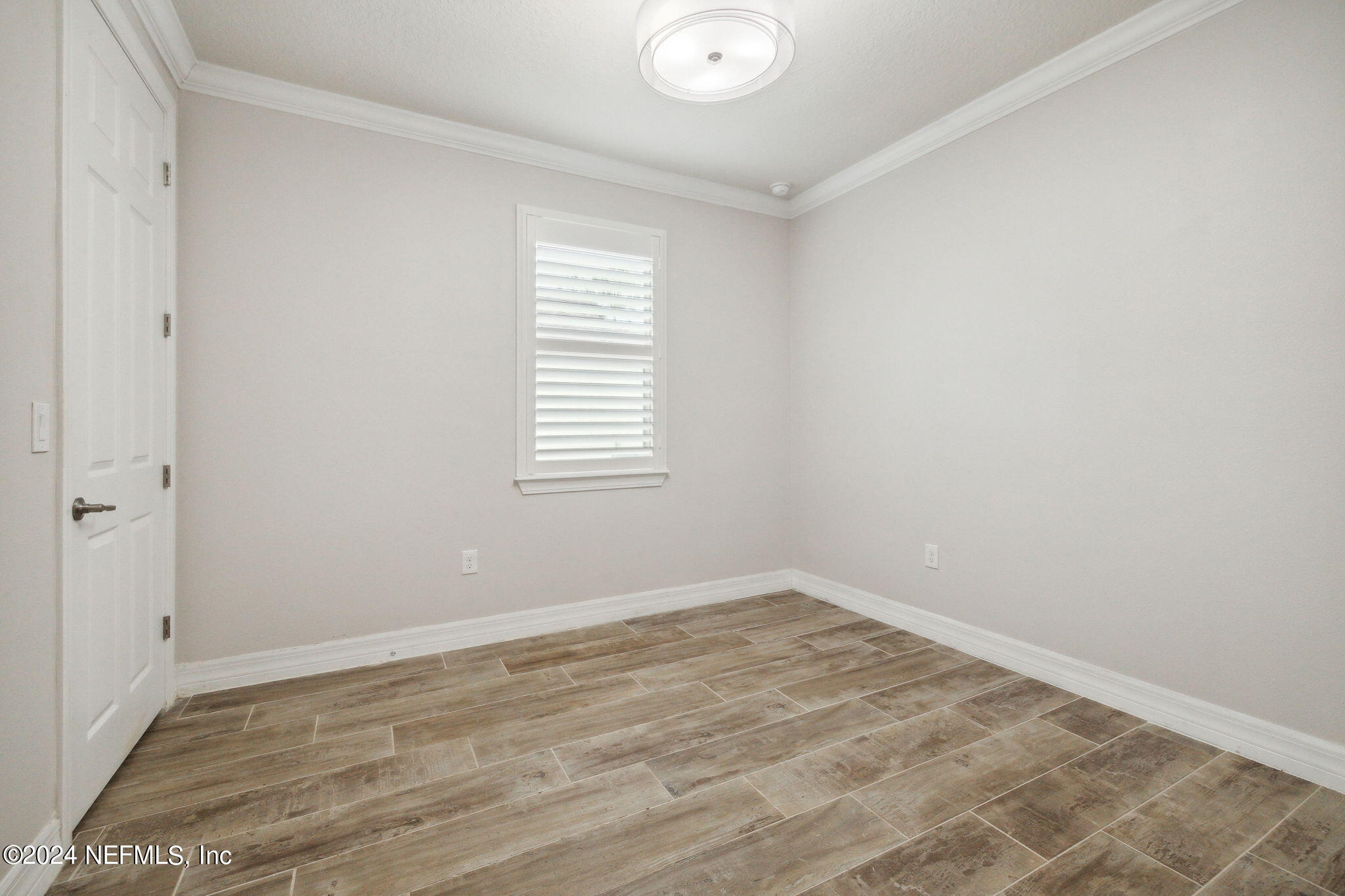 376 Eagle Pass Drive Ponte Vedra, FL 32081 - Photo 22 of 52 wooden floor in an empty room with a window