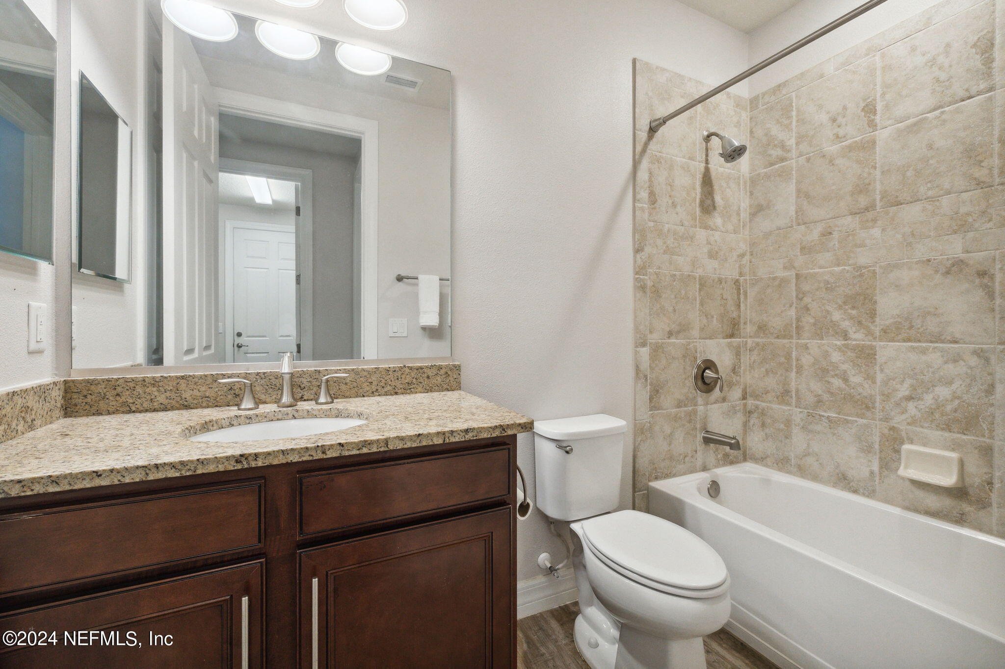 376 Eagle Pass Drive Ponte Vedra, FL 32081 - Photo 23 of 52 a bathroom with a granite countertop bathtub sink mirror vanity and toilet
