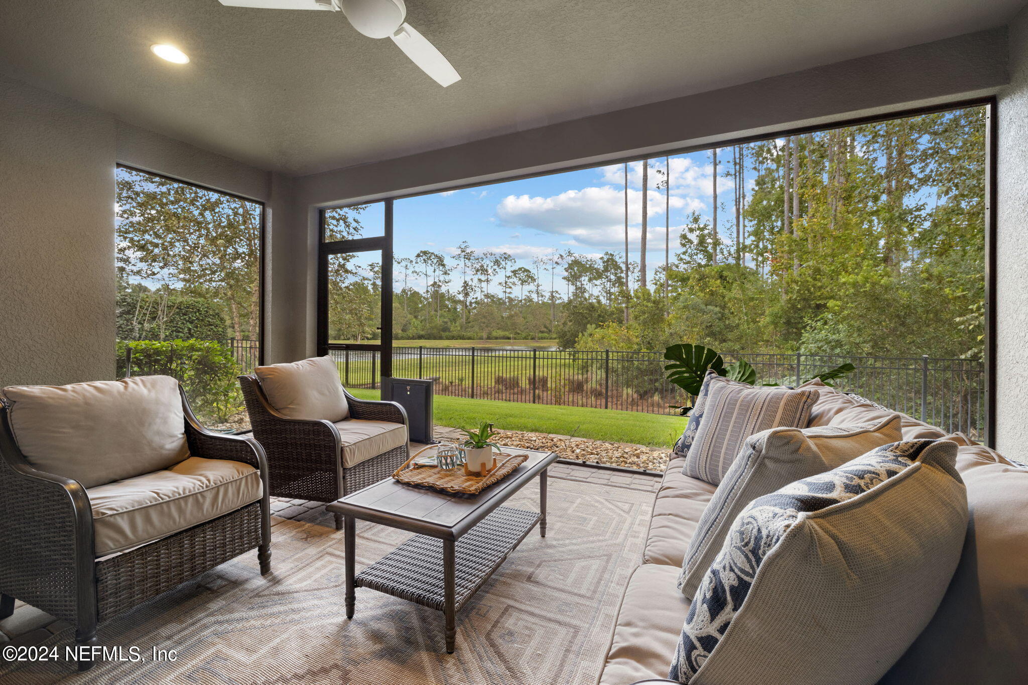 376 Eagle Pass Drive Ponte Vedra, FL 32081 - Photo 29 of 52 a living room with furniture and a floor to ceiling window