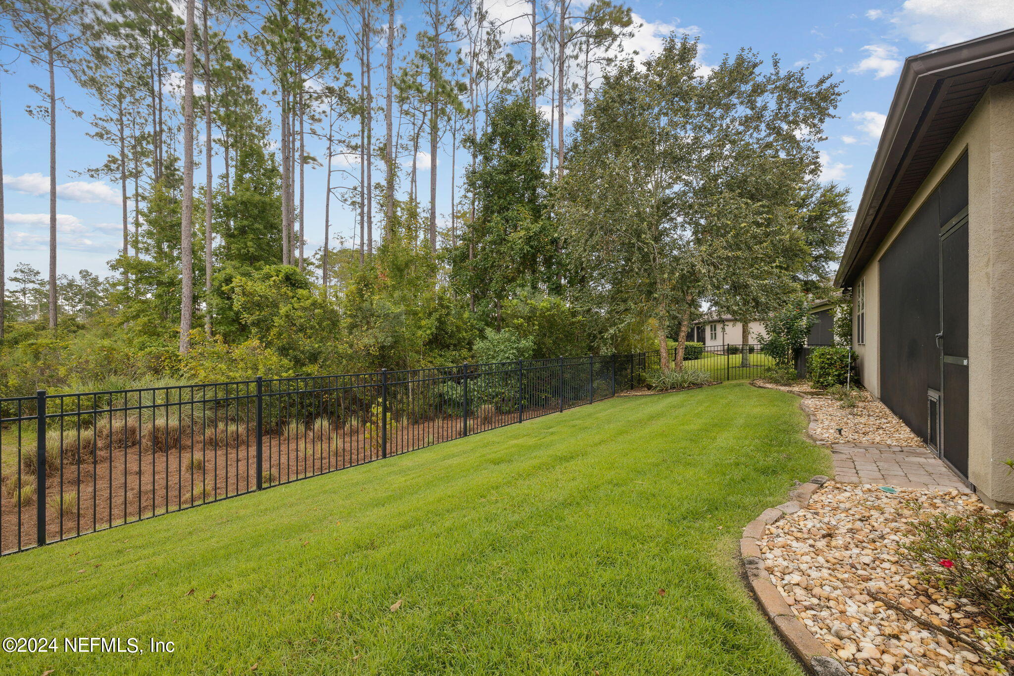 376 Eagle Pass Drive Ponte Vedra, FL 32081 - Photo 33 of 52 a view of a backyard with large trees