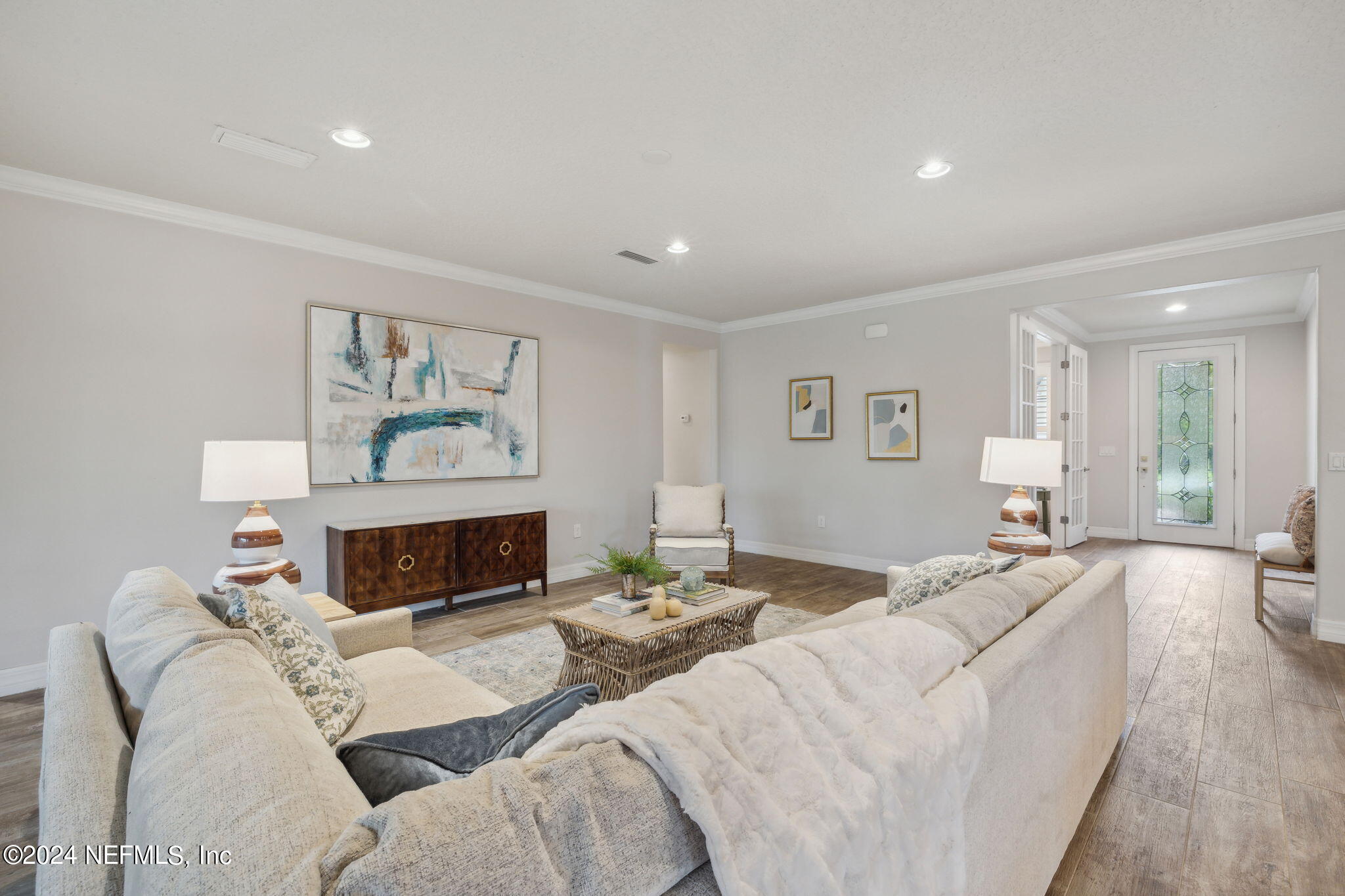 376 Eagle Pass Drive Ponte Vedra, FL 32081 - Photo 4 of 52 a living room with furniture a flat screen tv and a fireplace