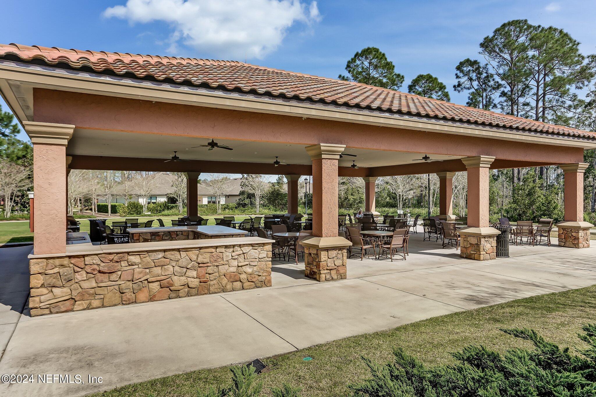 376 Eagle Pass Drive Ponte Vedra, FL 32081 - Photo 50 of 52 a view of a patio with furniture and floor to ceiling window