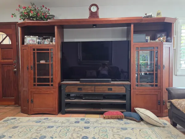 a bathroom with a toilet and a mirror