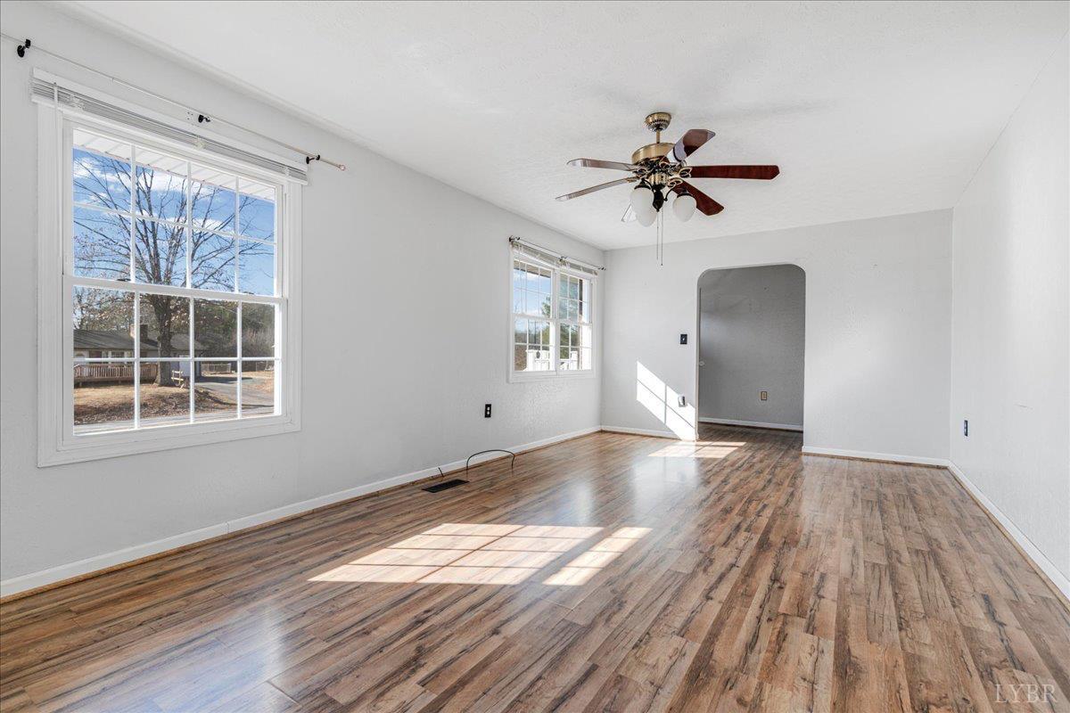 813 Doss Road Concord, VA 24538 - Photo 10 of 31 a view of empty room with wooden floor and fan