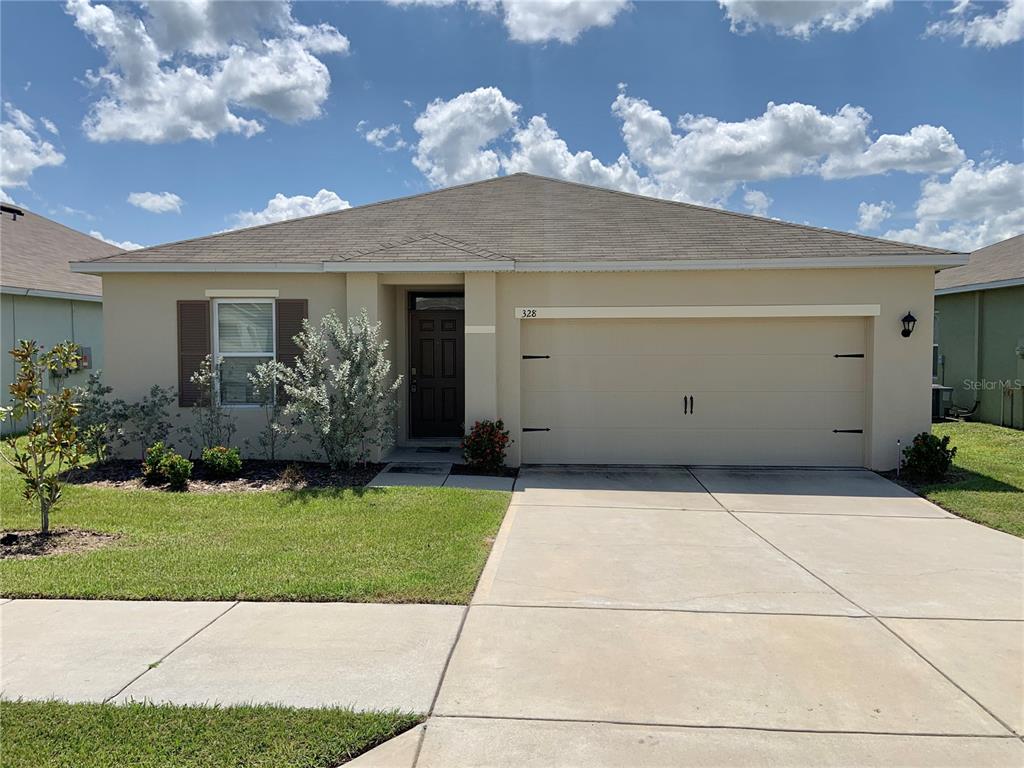 328 Corso Loop Winter Haven, FL 33884 - Photo 1 of 1 a view of a house with a yard