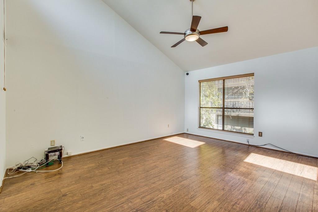 4411 Gilbert Avenue, Unit 10 Dallas, TX 75219 - Photo 9 of 11 wooden floor in an empty room with a window